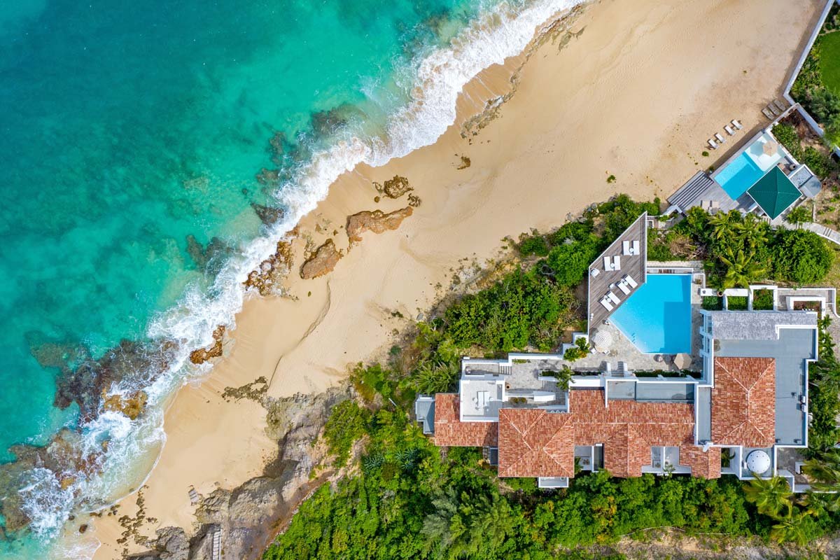 Aerial view of Villa L'Oasis with dual pools and direct beach access, Terres Basses, St. Martin