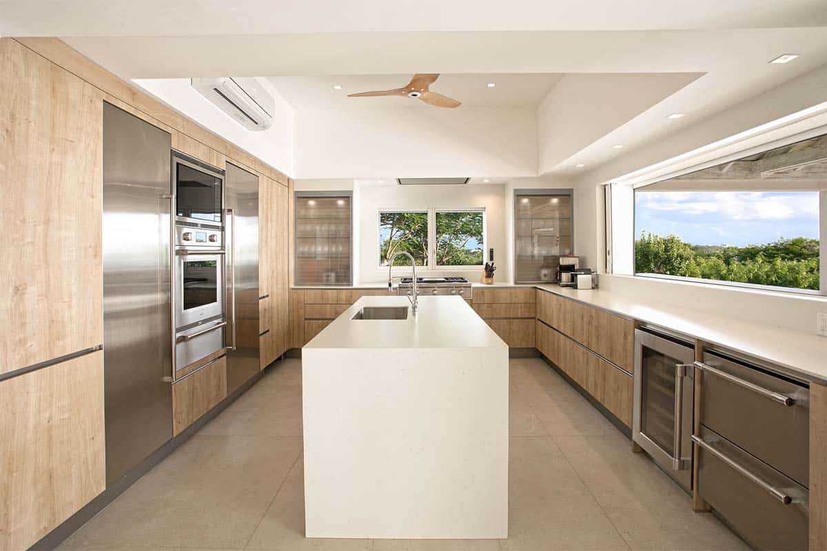 Modern kitchen with Wolf and Sub-Zero appliances, island, and breakfast bar at Villa Avanti, St. Martin