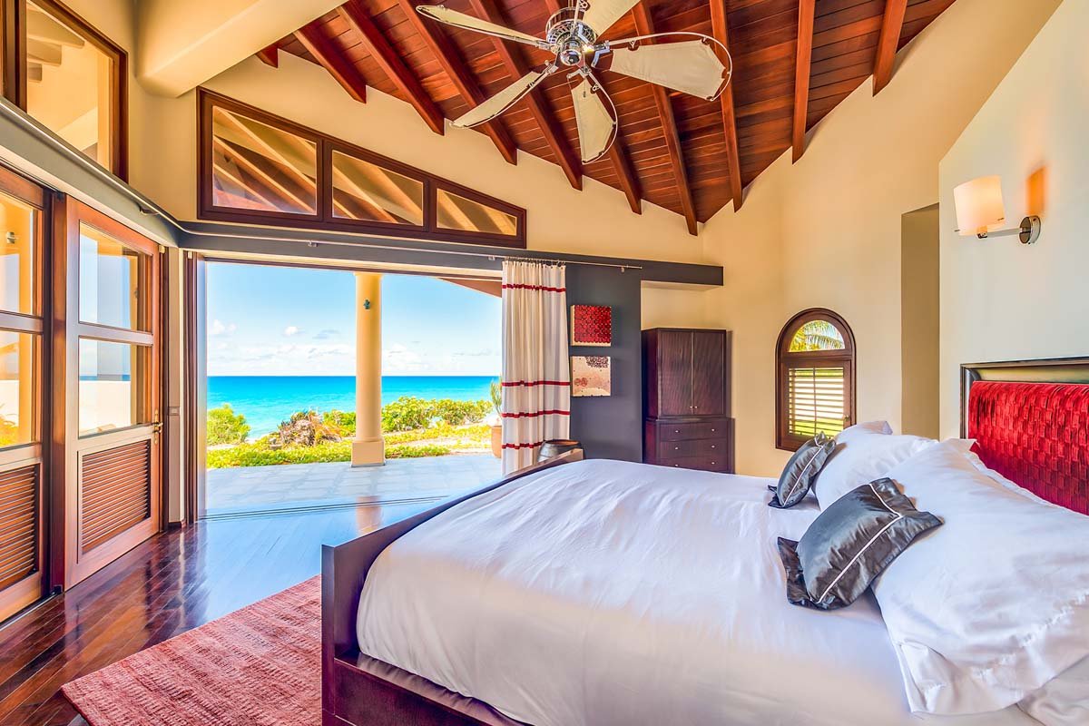 Ocean-view king bedroom with terrace access at Casa de la Playa, Baie Longue, St. Martin
