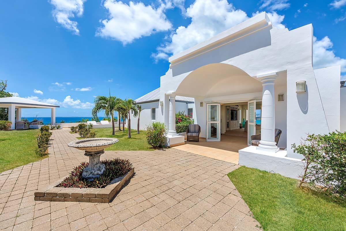 Villa Terrasse de Mer entrance, Terres Basses, St. Martin – gated courtyard with tropical landscaping