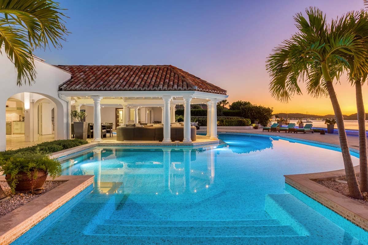 Villa Petite Plage 4 pool at dusk, Grand Case, St. Martin – heated horseshoe-shaped pool with ocean view