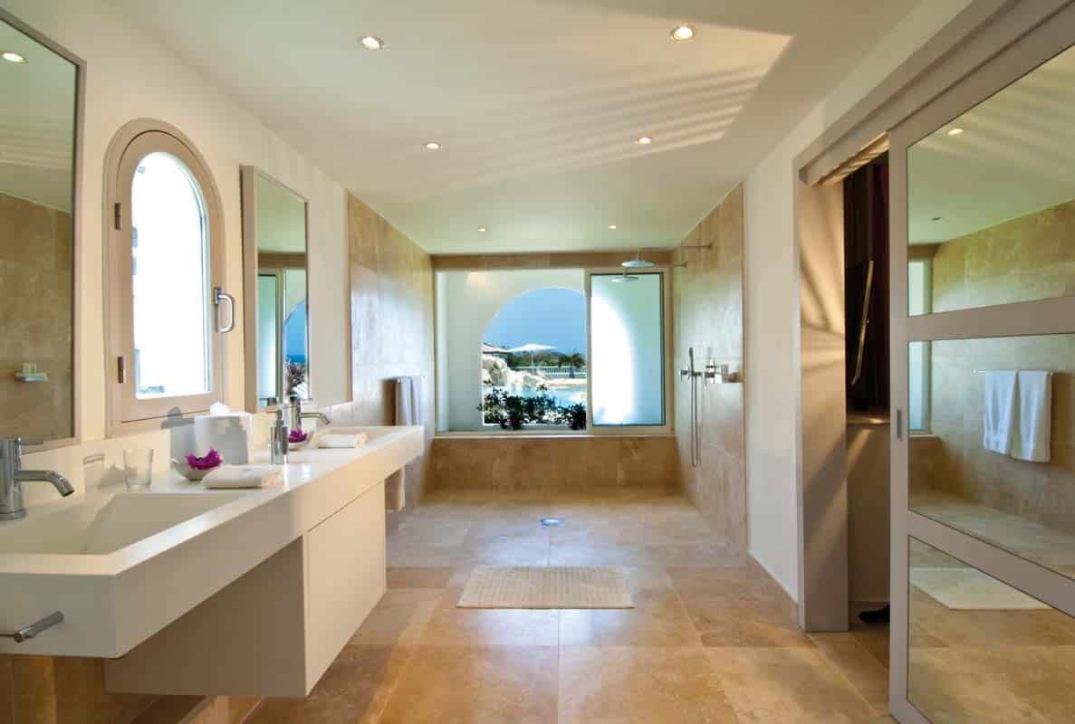 Elegant bathroom at Sandyline Estate, Terres Basses, St. Martin, featuring a freestanding tub with ocean views