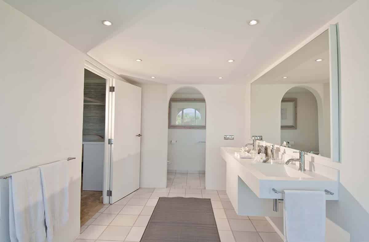 Elegant bathroom at Sandyline Estate, Terres Basses, St. Martin, featuring a freestanding tub with ocean views