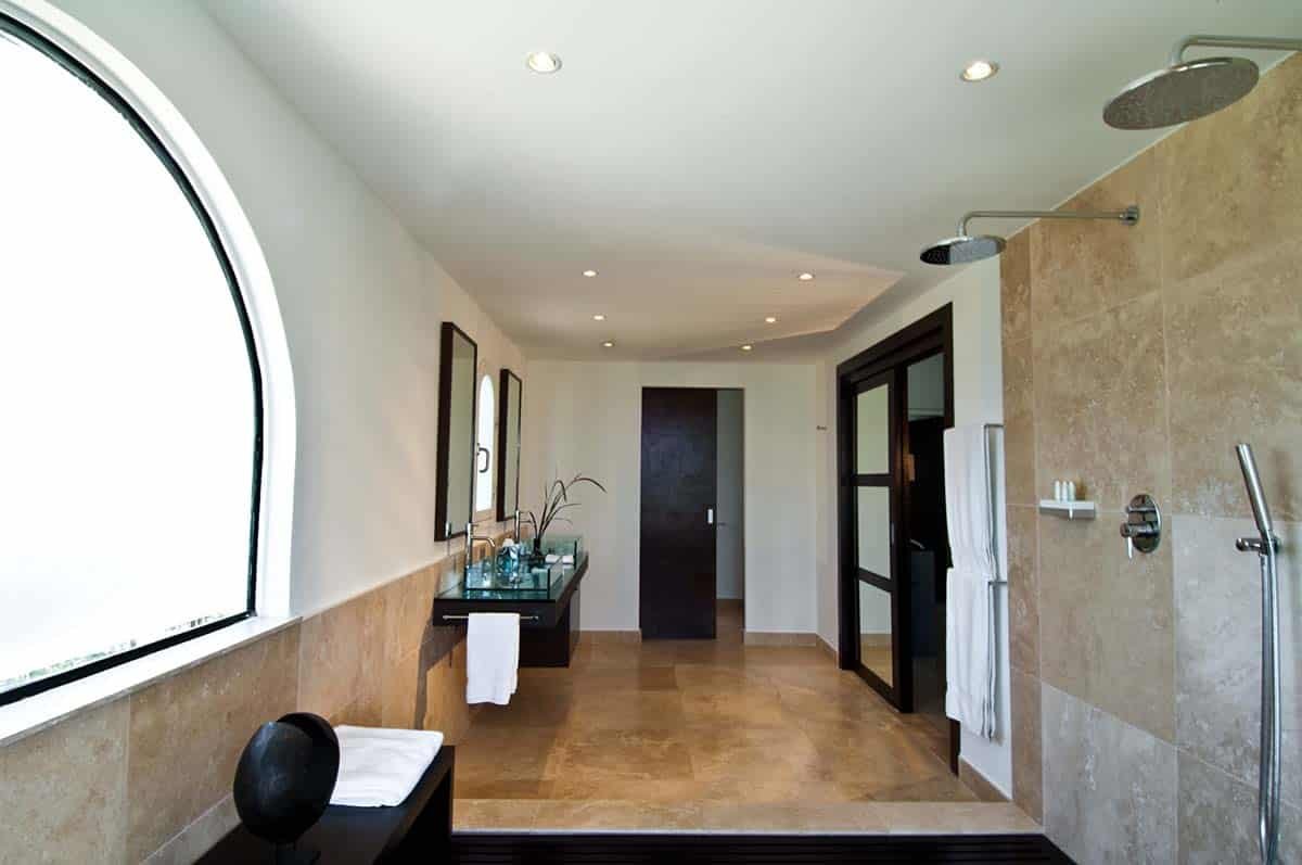 Elegant bathroom at Sandyline Estate, Terres Basses, St. Martin, featuring a freestanding tub with ocean views.