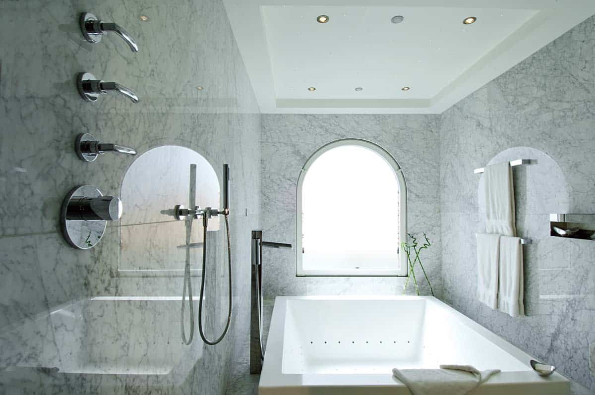 Master bathroom with double vanity, soaking tub, and walk-in shower at Villa Sandyline, Terres Basses, St. Martin