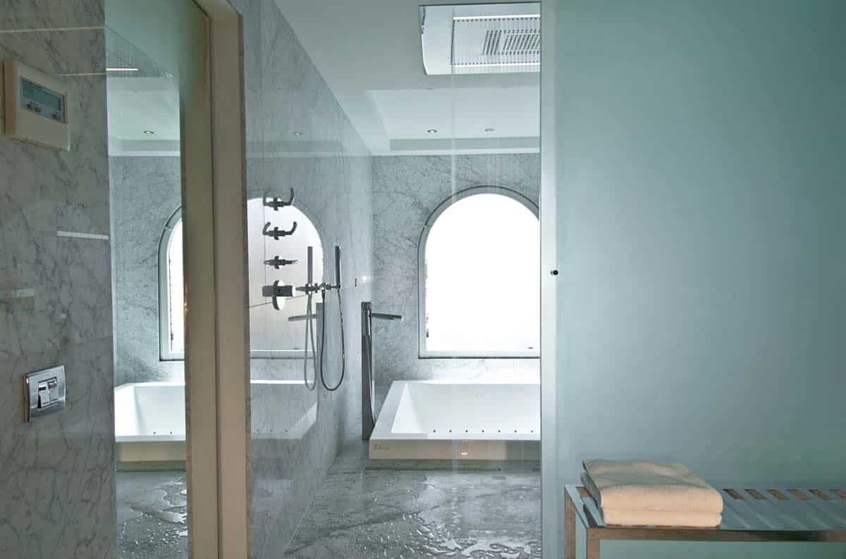 Master bathroom with double vanity, soaking tub, and walk-in shower at Villa Sandyline, Terres Basses, St. Martin