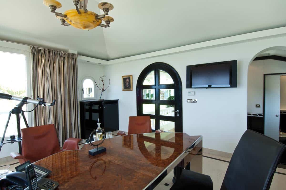 Art Deco-style private office with desk and ocean view at Villa Sandyline, Terres Basses, St. Martin