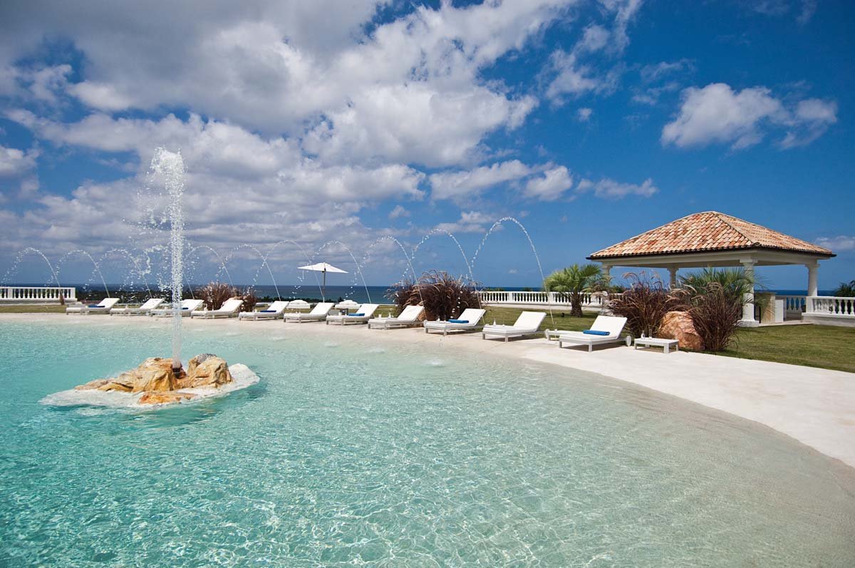 Beach-style pool with water slide and Jacuzzi at Villa Sandyline, Terres Basses, St. Martin