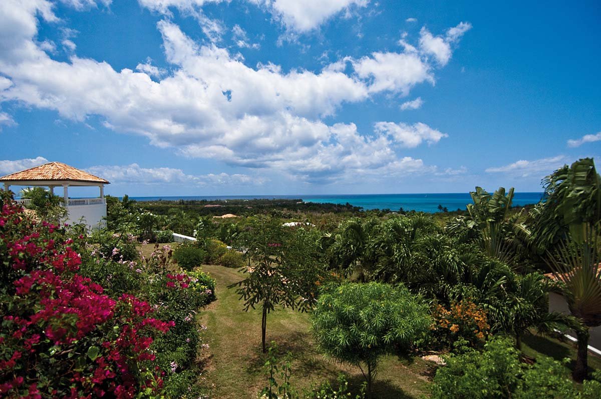 Lush tropical garden with koi pond at Villa Sandyline, Terres Basses, St. Martin