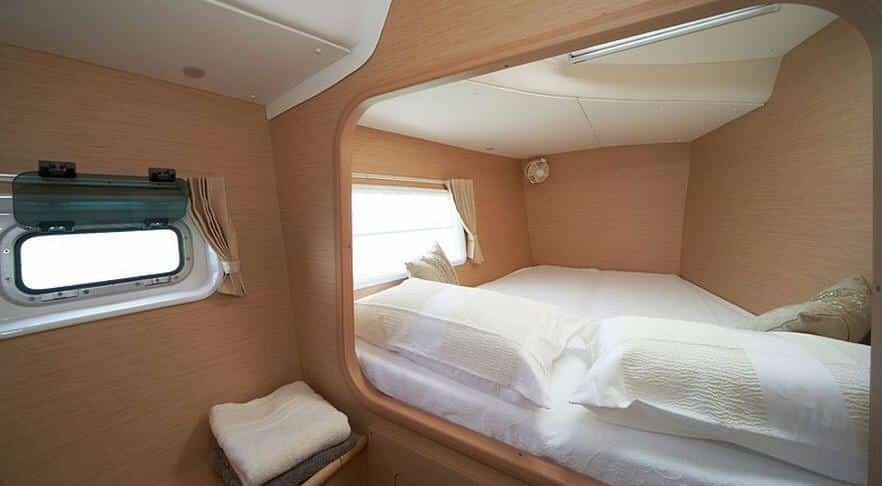 Two-bedroom cabin interior aboard 38-ft catamaran charter, luxury boat in St. Maarten