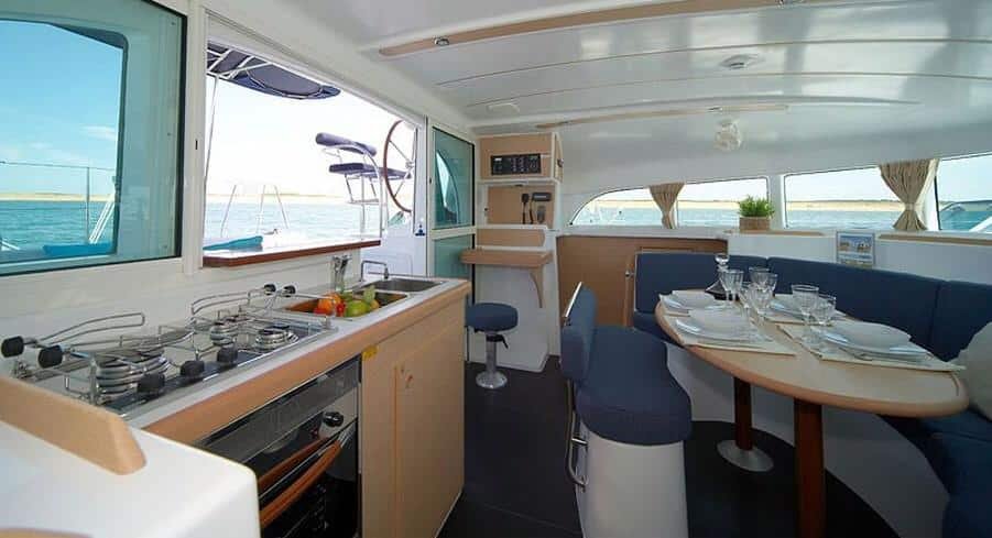 Compact galley kitchen interior aboard a luxury catamaran, charter service in St. Maarten