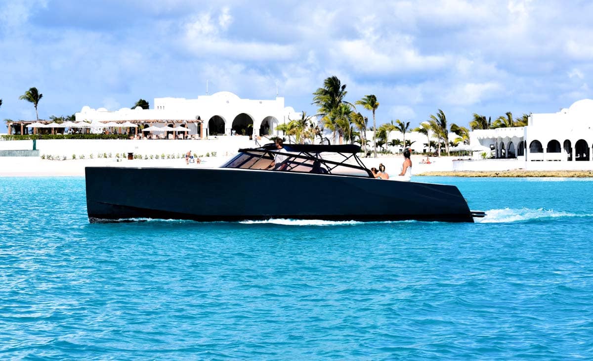 Sleek VanDutch 16 powerboat gliding over turquoise water, luxury charter service in St. Maarten