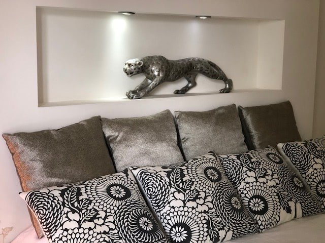 Details Dream Cushions" bedroom with king-size bed and plush pillows at Villa Paloma, Orient Bay, St. Martin.