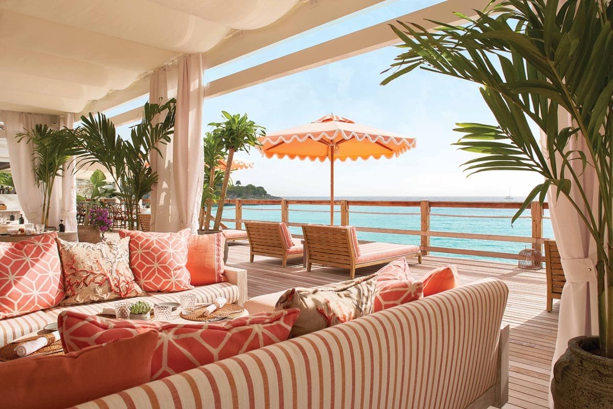 Elegant dining terrace overlooking ocean at Laplaj restaurant, luxury beach resort in St. Maarten