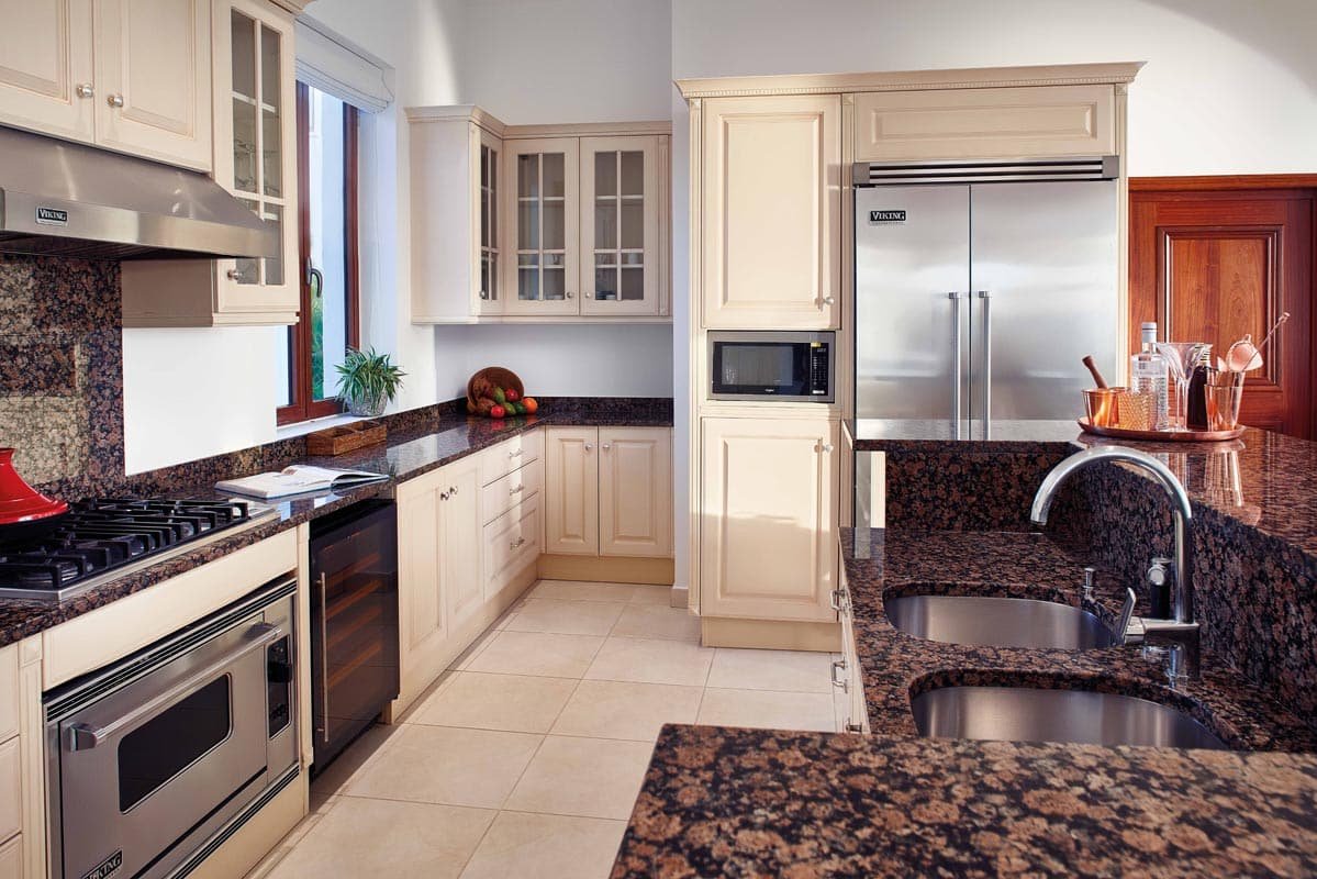 Signature Villa at Belmond La Samanna, featuring a spacious living area, private infinity pool, and panoramic views of Baie Longue Beach.