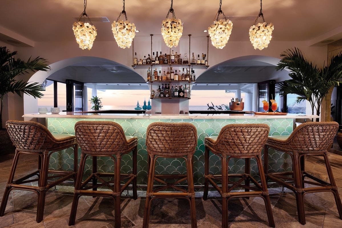 Elegant bar terrace overlooking beach and ocean at luxury resort in St. Maarten