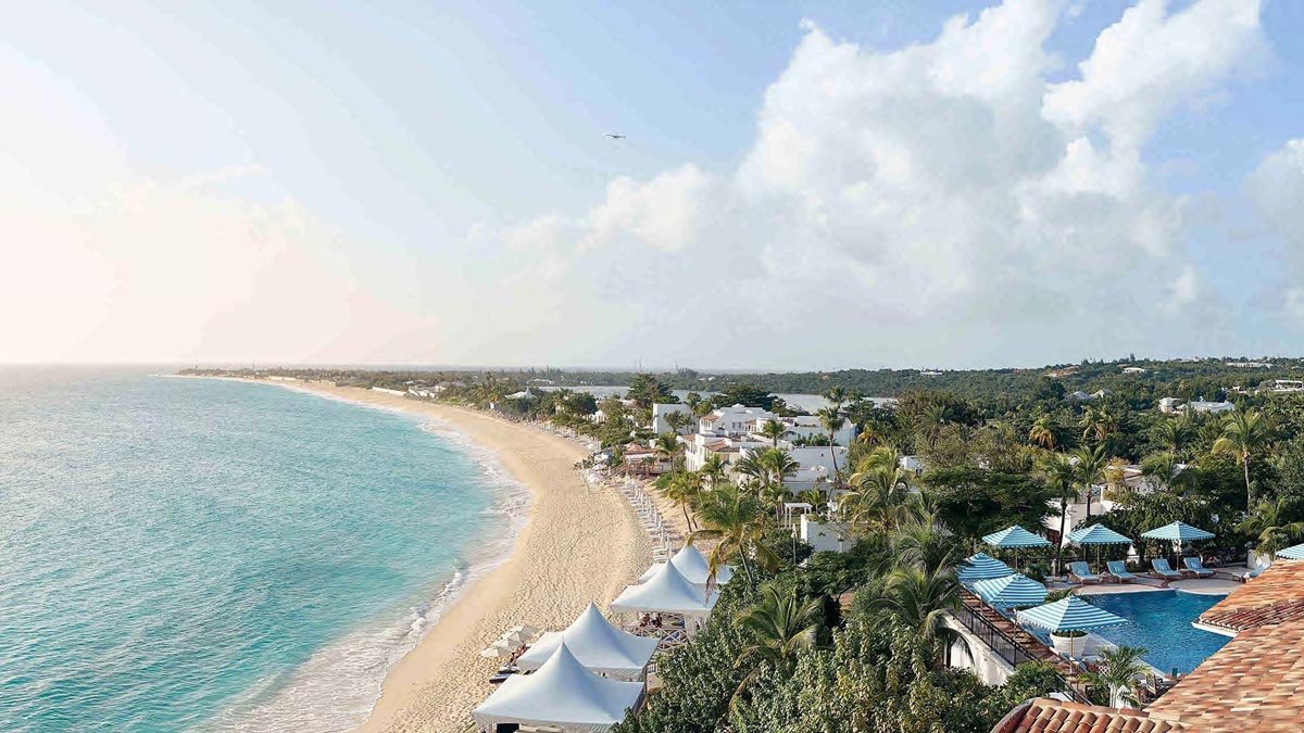 White-sand beach and ocean from terrace view at St. Maarten resort