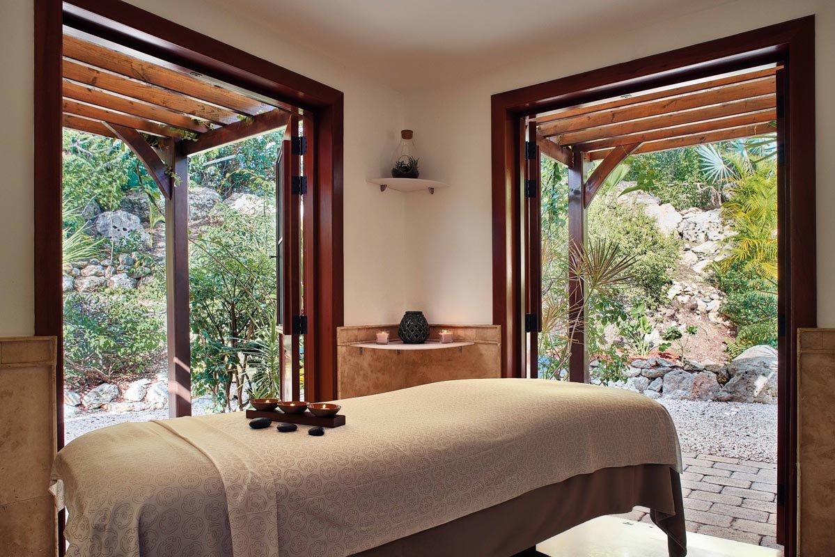 Relaxing spa treatment room with ocean view, luxury wellness center in St. Maarten