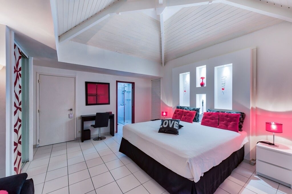 Love" bedroom with king-size bed and ambient lighting at Villa Paloma, Orient Bay, St. Martin