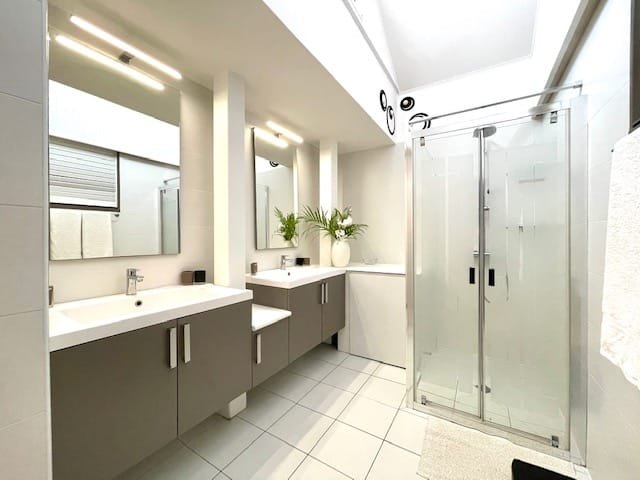 Modern bathroom with dual sinks and contemporary fixtures at Villa Paloma, Orient Bay, St. Martin.