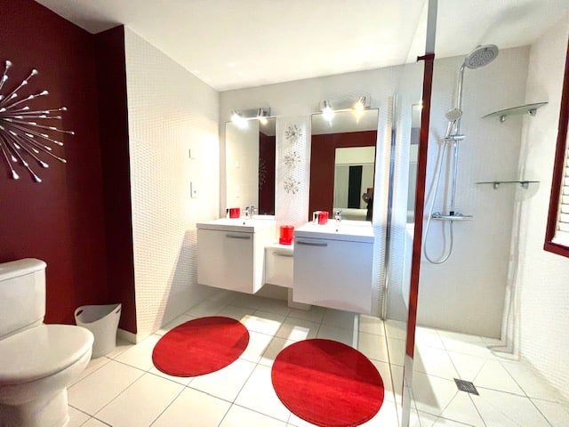 Elegant bathroom with dual sinks and modern fixtures in the Romantic Room at Villa Paloma, Orient Bay, St. Martin.