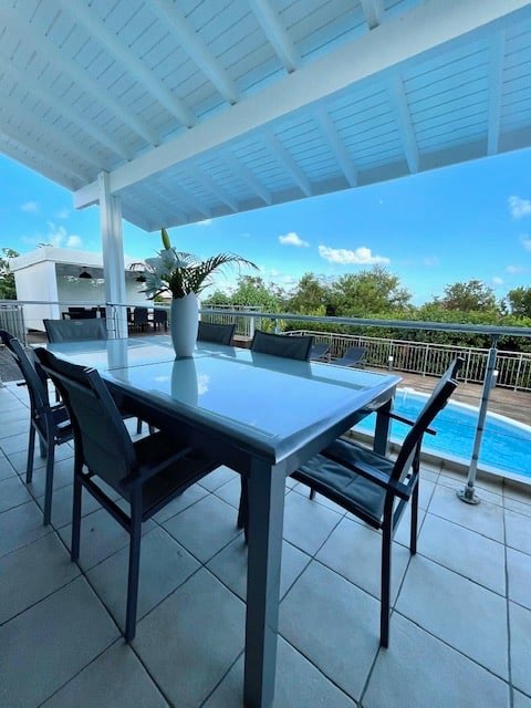 Elegant outdoor dining table at Villa Paloma, Orient Bay, St. Martin.