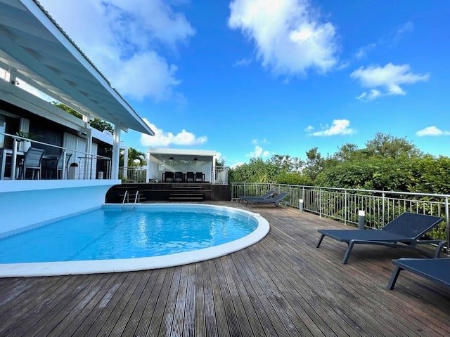 Villa Paloma poolside lounge chairs on a teak deck in Orient Bay, St. Martin
