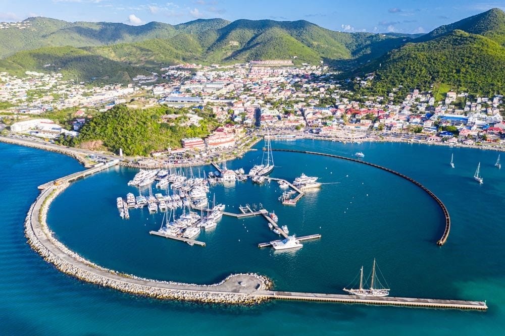 Arial view of Marigot, the main town and capital in the French Saint Martin, sharing the same island with dutch Sint Maarten. Fort St. Louis on a hill, yachts and a circular breakwaters of the marina.