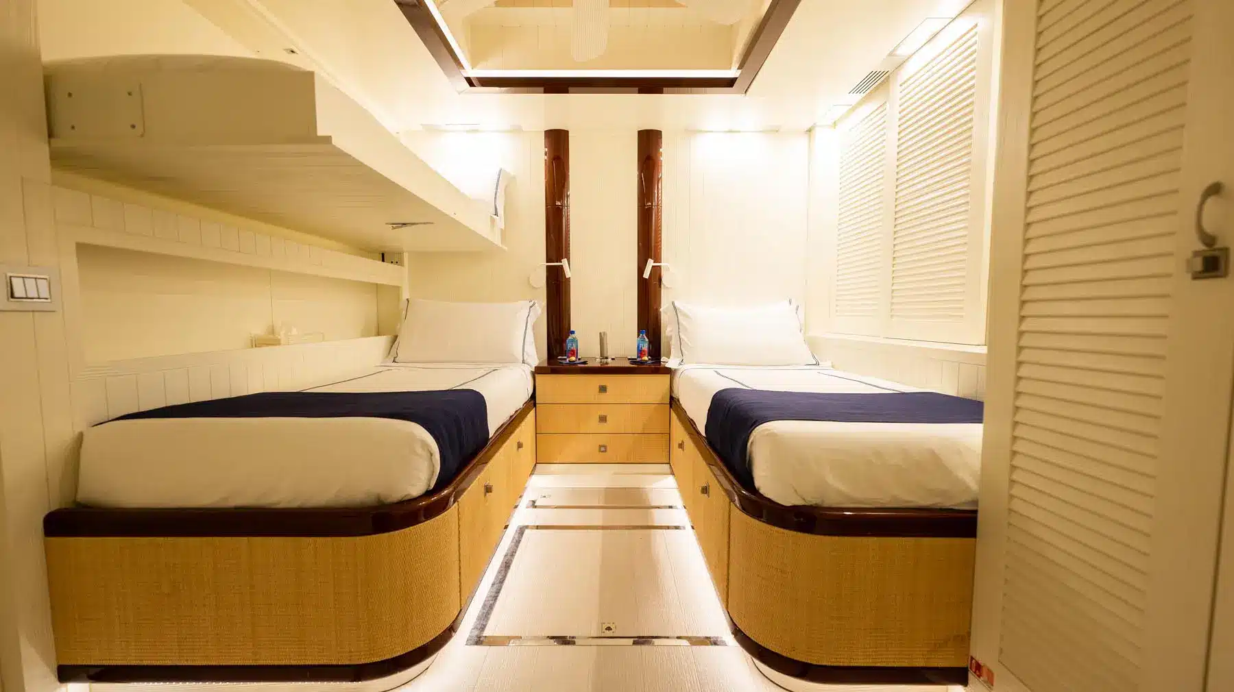 Luxury yacht interior featuring a spacious cabin with elegant furnishings.