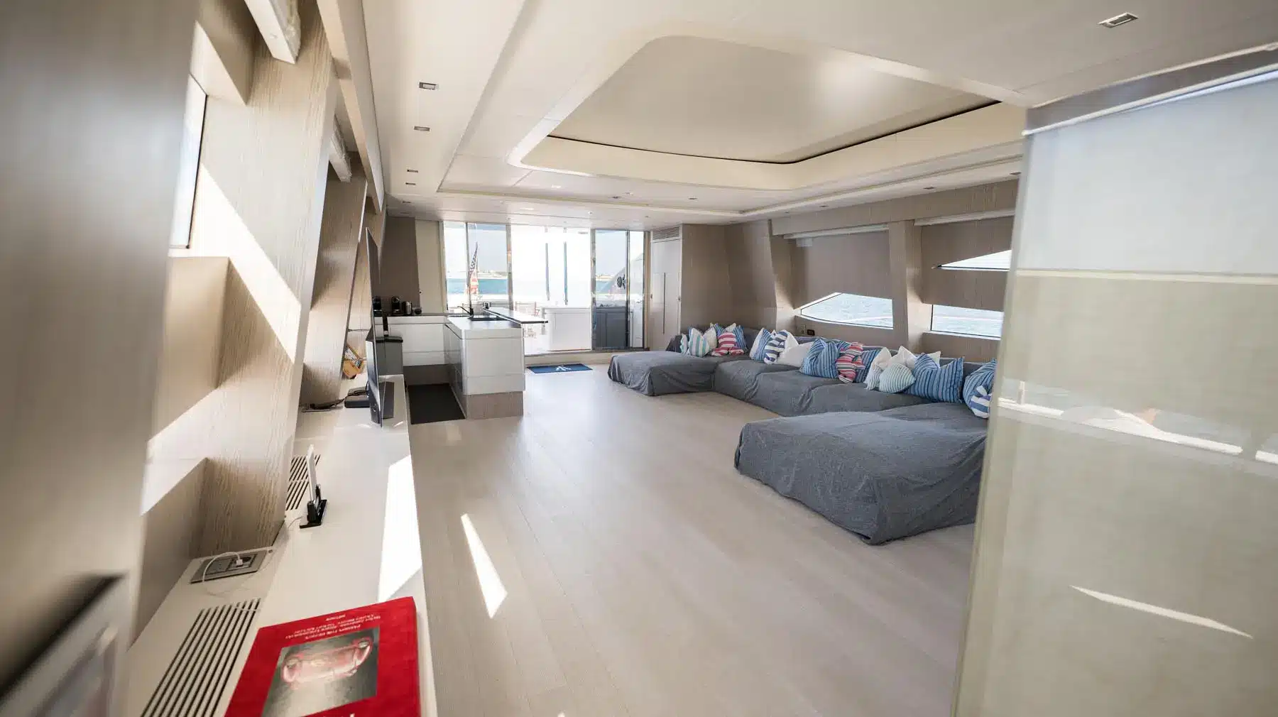 Luxury yacht interior with plush seating and panoramic windows in St. Maarten