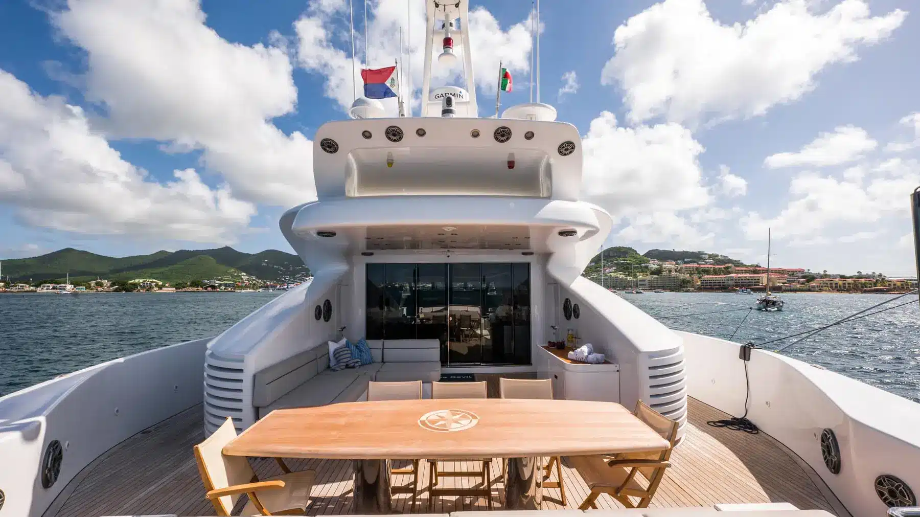 Luxury yacht interior with plush seating and panoramic windows in St. Maarten