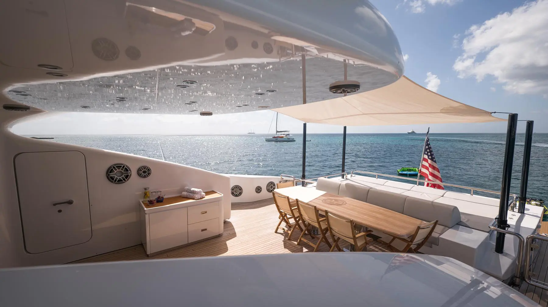 Luxury yacht interior with plush seating and panoramic windows in St. Maarten