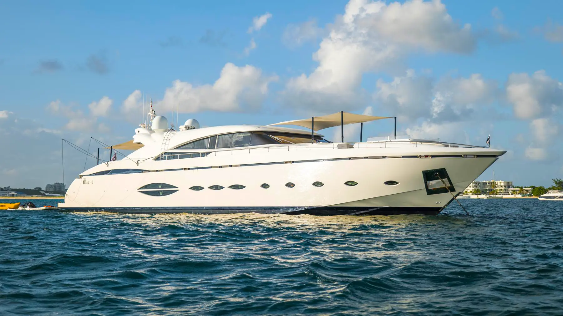 Mega-yacht BlueDevil cruising calm waters near St. Maarten coast