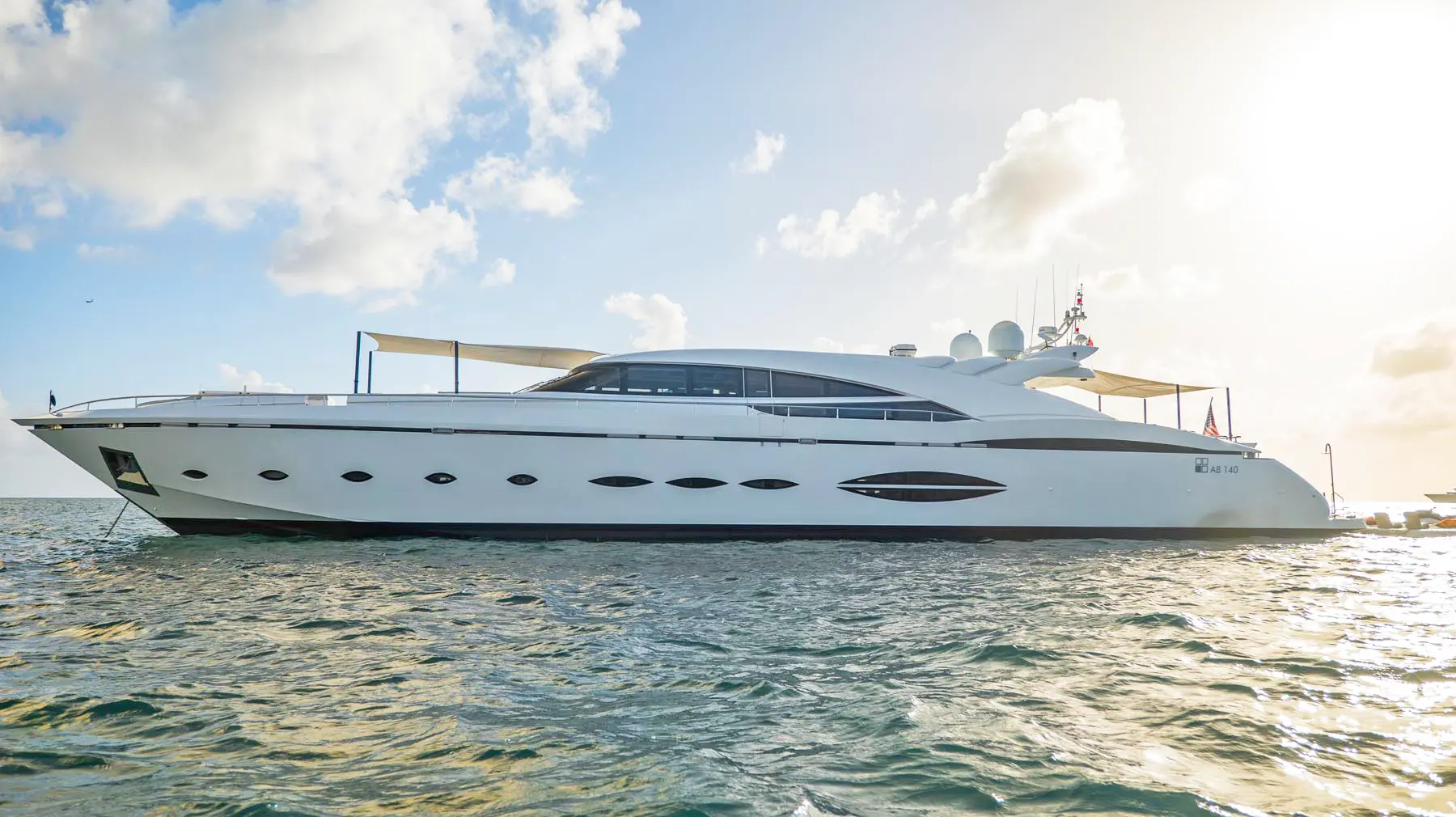 Luxury yacht interior with teak flooring, panoramic windows in St. Maarten