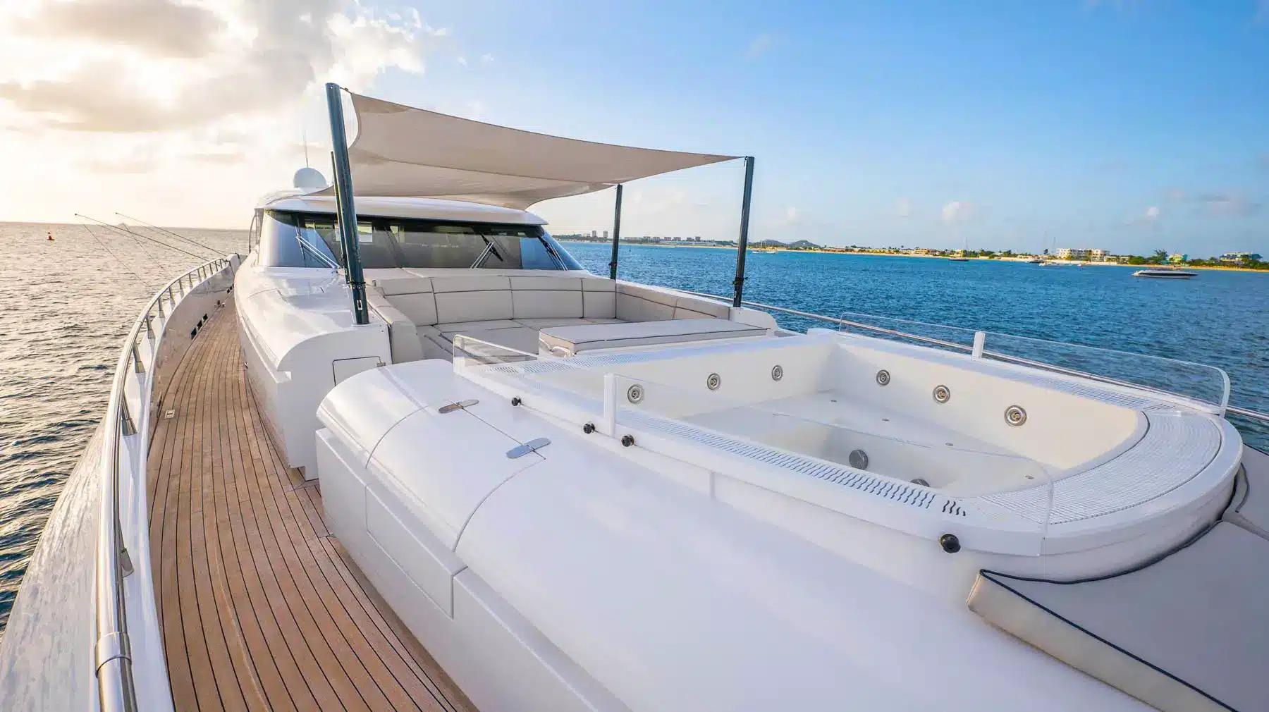 Spacious yacht interior lounge with light sofas and large windows in St. Maarten