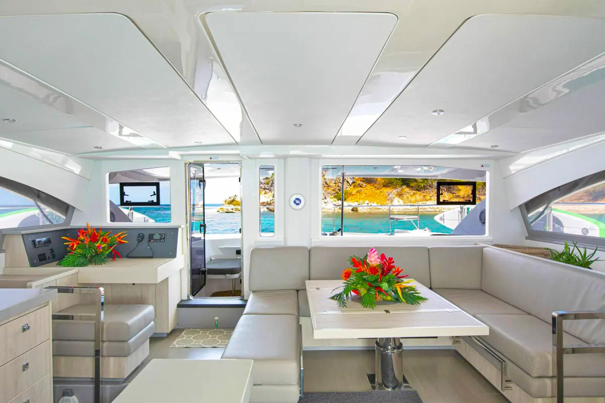 Vogue 51ft catamaran indoor lounge with plush seating and A/C in St. Maarten
