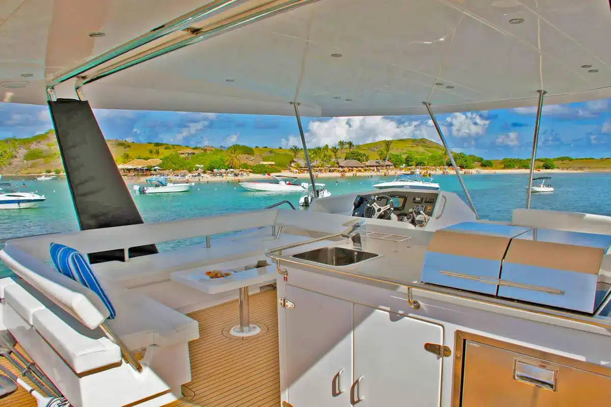 Vogue 51ft catamaran indoor lounge with plush seating and A/C in St. Maarten