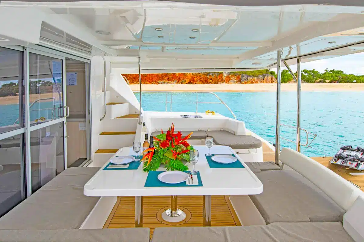 Vogue 51ft catamaran indoor lounge with plush seating and A/C in St. Maarten