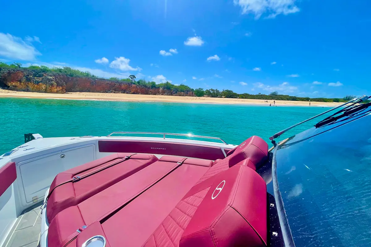Forward sunbed area on the Stellar 34ft Schaefer V33 yacht, featuring plush cushions and flip-up armrests
