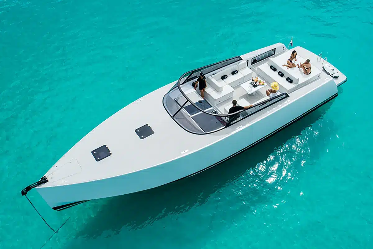 VanDutch 55 yacht cruising near St. Maarten's coastline, showcasing its sleek design and luxury features