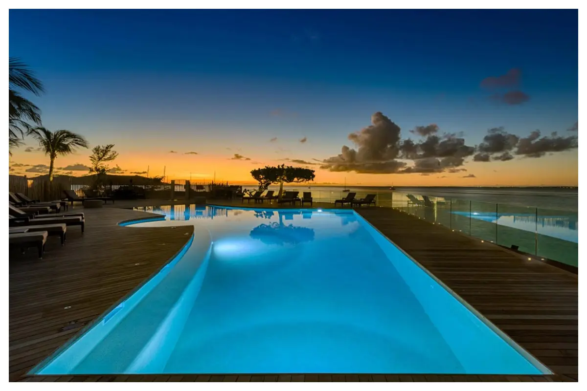Pool at Grand Case Beach Club in St. Martin during sunset, ocean view beyond