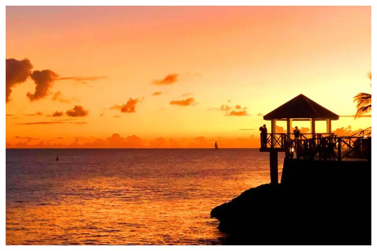 Beautiful Sunset in Maho Sunset over Maho Beach, Sint Maarten—vibrant sky and calm Caribbean waters