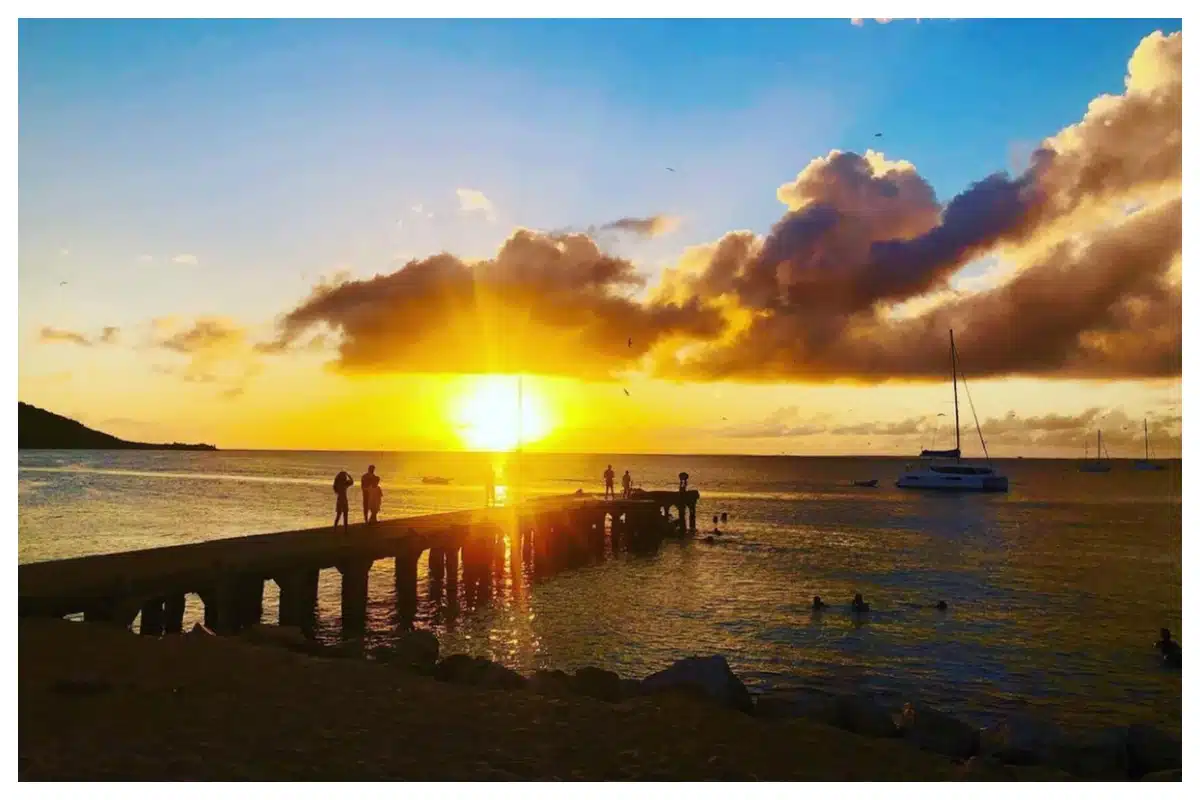 Sunset over Grand Case Beach, Sint Maarten—vibrant sky and tranquil Caribbean waters