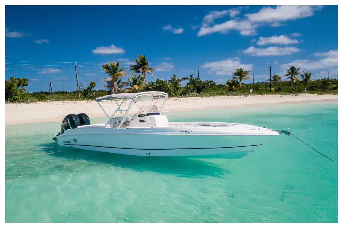 Group enjoying a private charter aboard HEREMOANA, a Scarab 32 Sport boat, cruising the turquoise waters of St. Martin