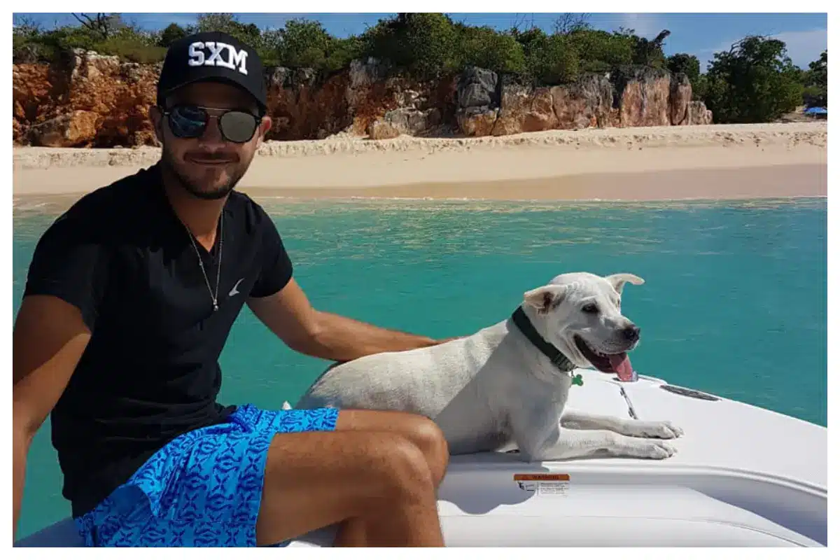 Dog-friendly powerboat cruising in St. Maarten's turquoise waters, ideal for pet-friendly charters
