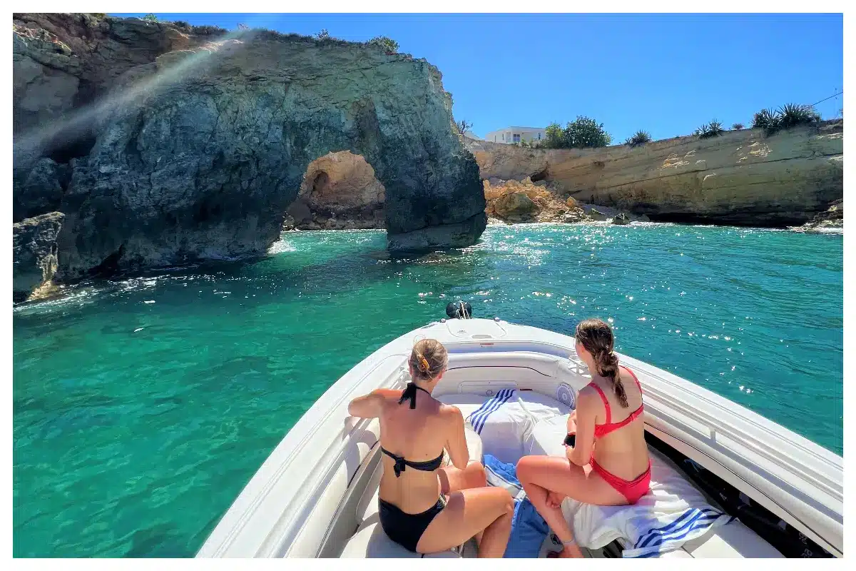 Scarab 32FT Sport boat anchored near a secluded beach, ideal for discovering hidden gems in St. Maarten