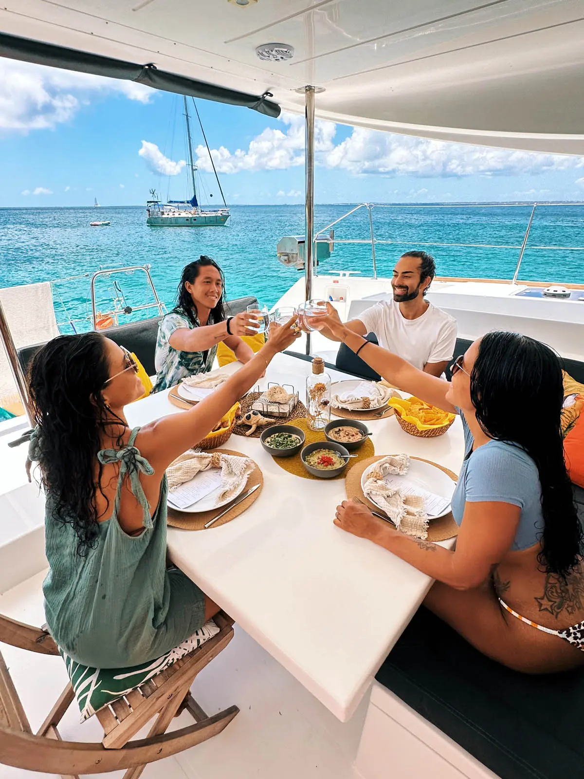 Lagoon 450S power catamaran 'Galaxy' equipped with paddle boards, kayak, floating mat, and snorkeling gear in turquoise waters.