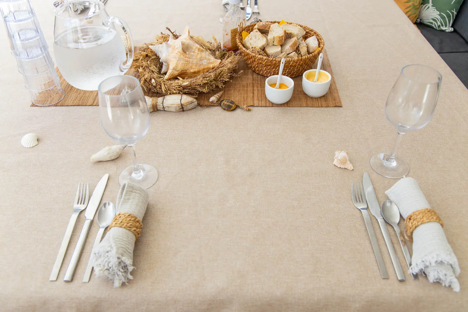 Elegant table setting aboard Lagoon 450S power catamaran in St. Maarten, featuring fine china and floral accents.