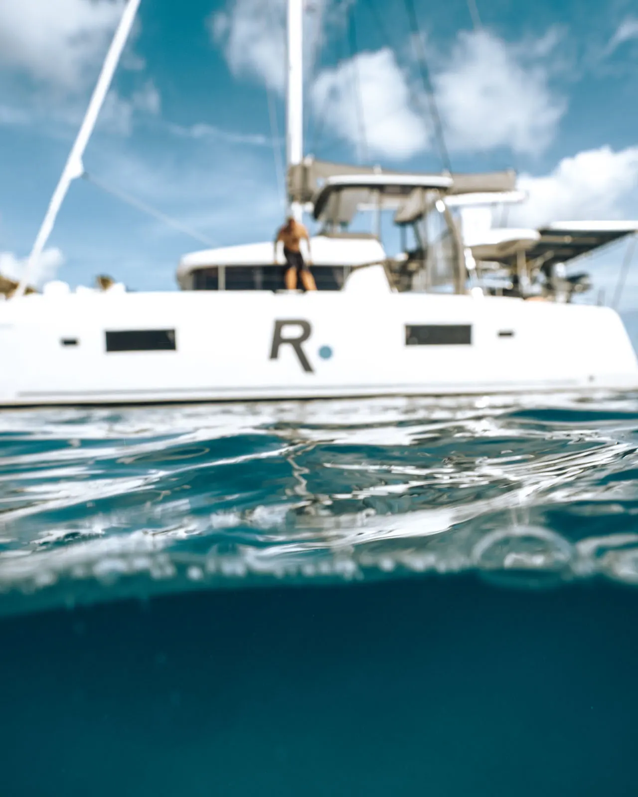 Renegades catamaran hull gliding over turquoise St. Maarten waters